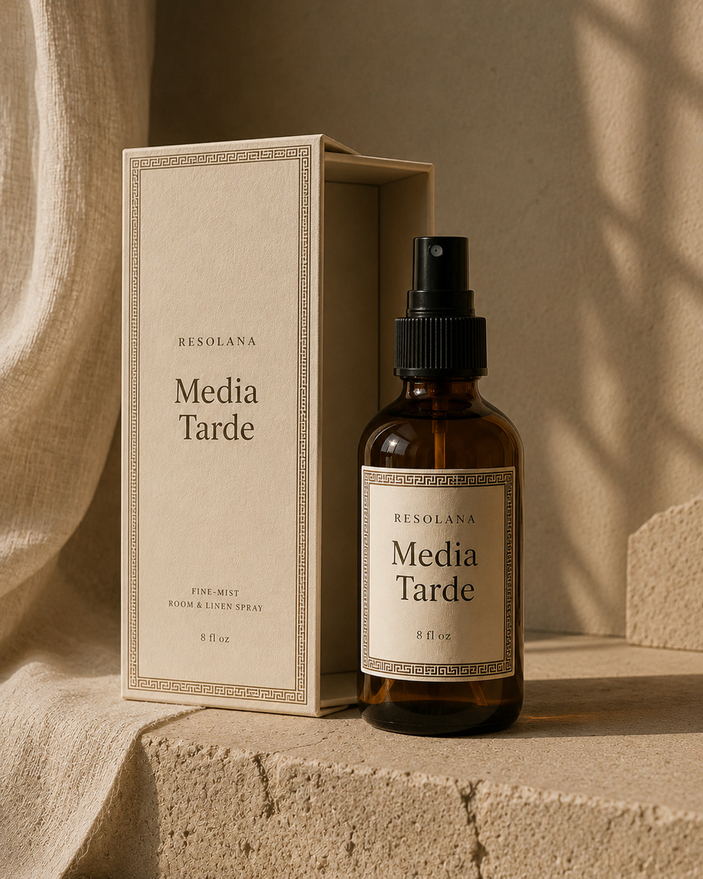 Media Tarde bottle and open cream box on stone